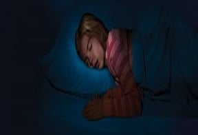 Teenager girl sleeping in her bed
